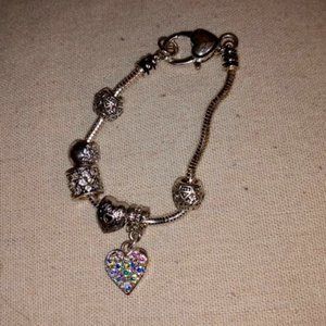 Silver Tone charm bracelet with AB rhinestone heart.